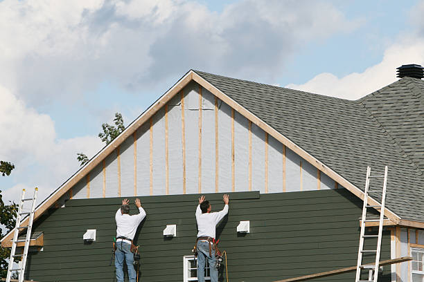 Professional Storm Damage Siding Repair technician working in Lansing, IL